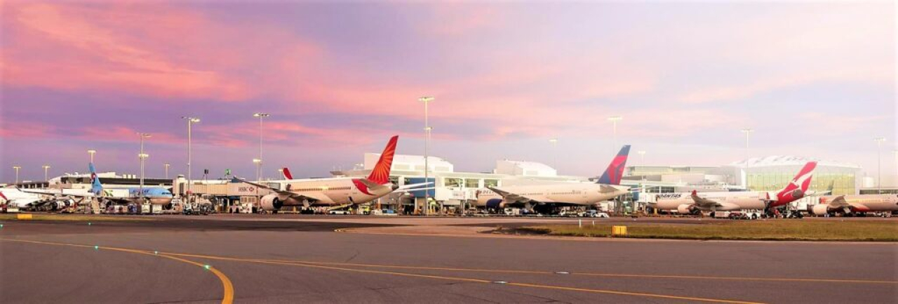 mod syd airport with planes on tarmac 1024x346